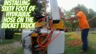 Installing a Sixty Foot Hydraulic Hose on the Boom of the Bucket Truck