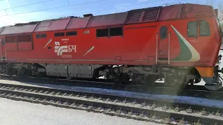 Магистральный тепловоз ТЭП70БС-117 с пассажирским поездом близ о.п. Роща(Минск).