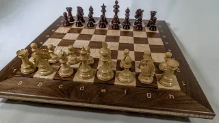 Double-sided chess board with algebraic notation and inlaid quotations to sit atop a box for pieces