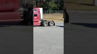 Trucker taking a dump in broad daylight.  Lazy ass shitbag.