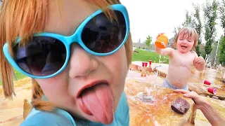 Backyard SPLASH PAD!!  Family Fun in the water, Niko launching cups, and playing neighbor with Adley