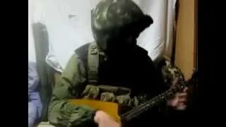 Russian soldier plays the balalaika