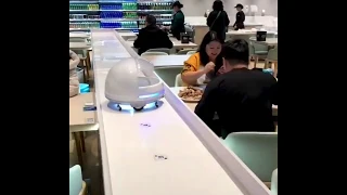 Futuristic Restaurant in 3020 .Robots as waiter must watch the idea AI