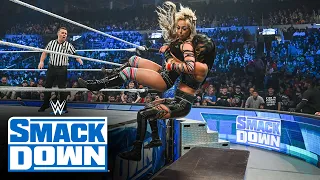 Liv Morgan and Sonya Deville crash through a table