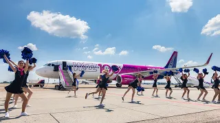 Pom pom girls in front of the Wizz Air 100th Airbus - 235