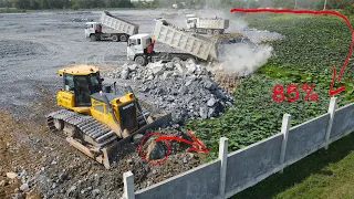 Good Work Continue Pouring Stone by Team Operator Bulldozer and Dump Truck In Action Moving Stone