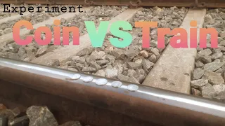 Experiment; Coin vs Train. railway track in coin . high speed train crushing the coin