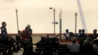 Blackhawks fan throws canuck jersey on ice