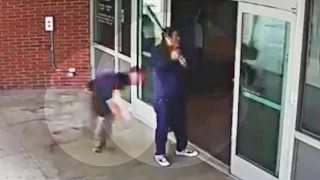 Surveillance: Cop Tackles Man Swinging Bat at Police Station