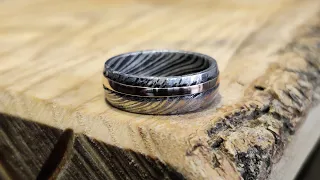 Hand forging stainless steel damascus ring with gold inlay in my backyard