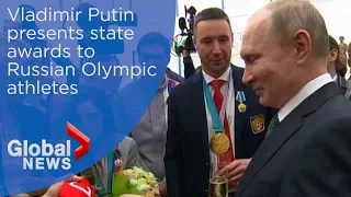 IOC lifts ban on Russia as Putin presents state awards to country's athletes