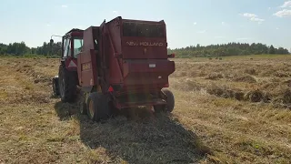 New Holland 644 hay baler in action