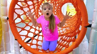 Diana and Roma have fun playing at the Indoor Playground for kids