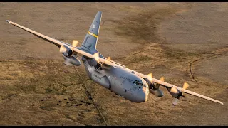 (U.S Air Force) Lockheed C-130H Classic Hercules flying above the clouds.