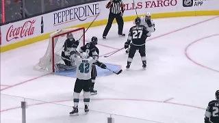 Sharks' Ward redirects puck with his skate past Kings' Quick for the lead