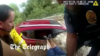 Moment woman rescued from car trapped in floods in Arizona