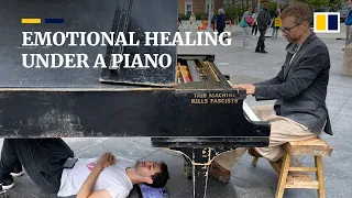 NYC busker invites people to lie under his piano to be immersed in music