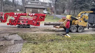 Ditch Witch SK1550 moving some logs