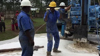 Water Well Drilling: Water at First Well in Ethiopia with Drill Rig