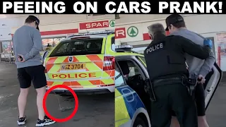PEEING ON PEOPLES CARS PRANK **POLICE INTERVENED**