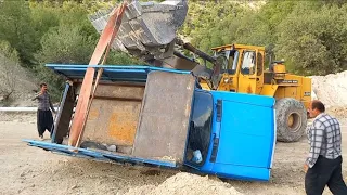 Truck overturned due to slippery road, Nissan, Volvo L120 loader،,2024,