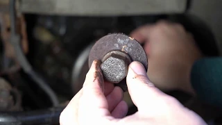 Removing a crank shaft bolt on an MG TF