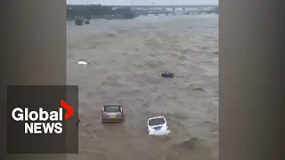 Typhoon Doksuri triggers mass floods in China, sweeps cars into surging waters