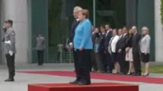 Merkel appears unsteady as she welcomes Finnish PM