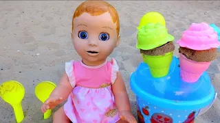 Baby doll playing with ice cream toys on the Playground. Video for kids - compilation.