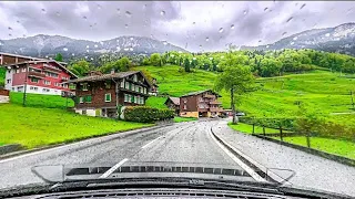 Beautiful Rain walking tour in Gimmelwald, Switzerland, A small swiss village..