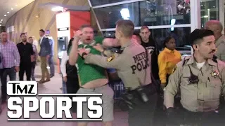 Fans Fight and Confront Cops After Khabib/McGregor UFC 229 Fight | TMZ Sports