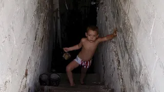 Ukraine family retreats to cellar during shelling