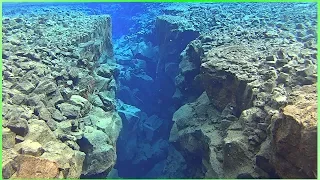 Freediving between lithospheric plates in Iceland 2018.