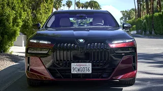 2023 BMW 760i xDrive G70 in Aventurin Red Metallic - Driving