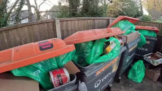 Dustcart/garbage driver collecting waste/garbage recycling in south London as a lone worker