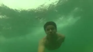 swimming under a wave at point dume