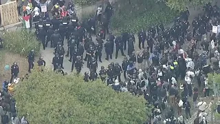 Officers respond to UCLA as protesters try to push into pro-Palestinian encampment