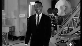 Nat King Cole sings "Day In Day Out"