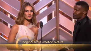 Lily James and Jamie Foxx present an Award at the 73rd Annual Golden Globe Awards