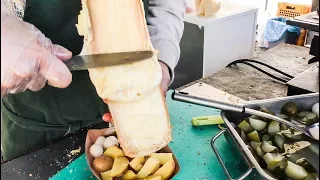 Swiss Raclette. Huge Melted Cheese Tasted in Prague. Street food of the Czech Republic