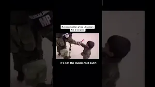 Russian soldier gives Ukrainian kid an ice pop🥲