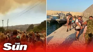 Crowds wait to be evacuated from Greek island of Rhodes as wildfires burn