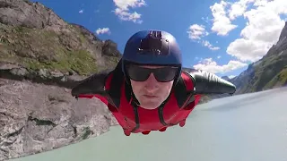 Wingsuit Flying Over a Dam and Dam Wall