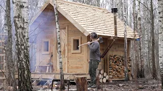 build a log cabin in one year using hand tools with a wooden roof