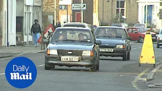 Classic Ford cars in traffic in London in the late 1980s - Daily Mail