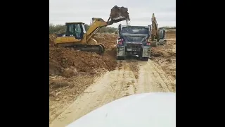 Caterpillar 973C loading endump truck.