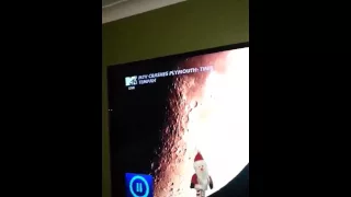 Santa flying across the moon II