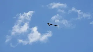 tic-tac UFO going in an out of clouds