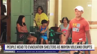 People head to evacuation shelters as Mayon volcano erupts