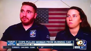 Virginia police officers pull woman from burning car